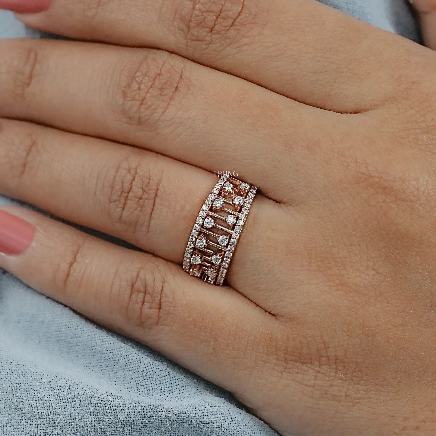 Woman hand Double Diamond Wedding ring styled with two rows of round diamonds