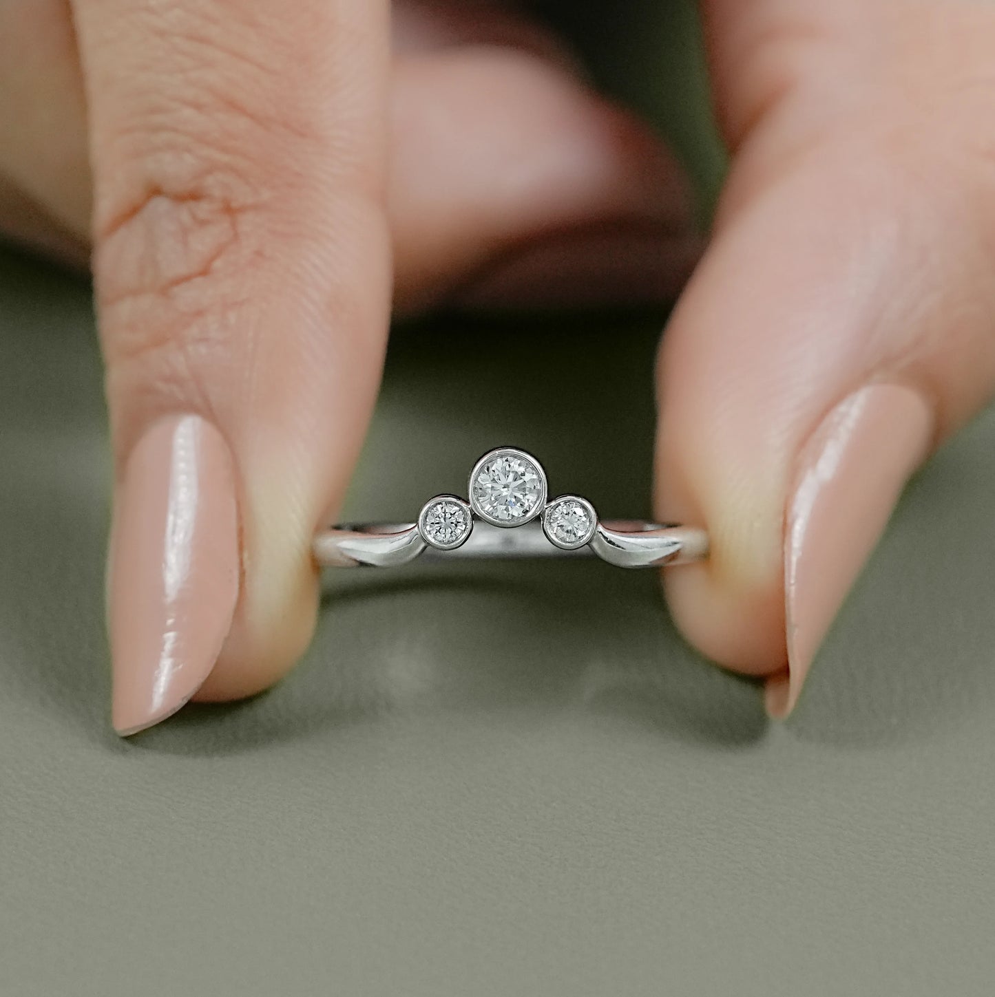 Close-up of a 14k gold wedding band women's style with precision-set lab grown diamonds.