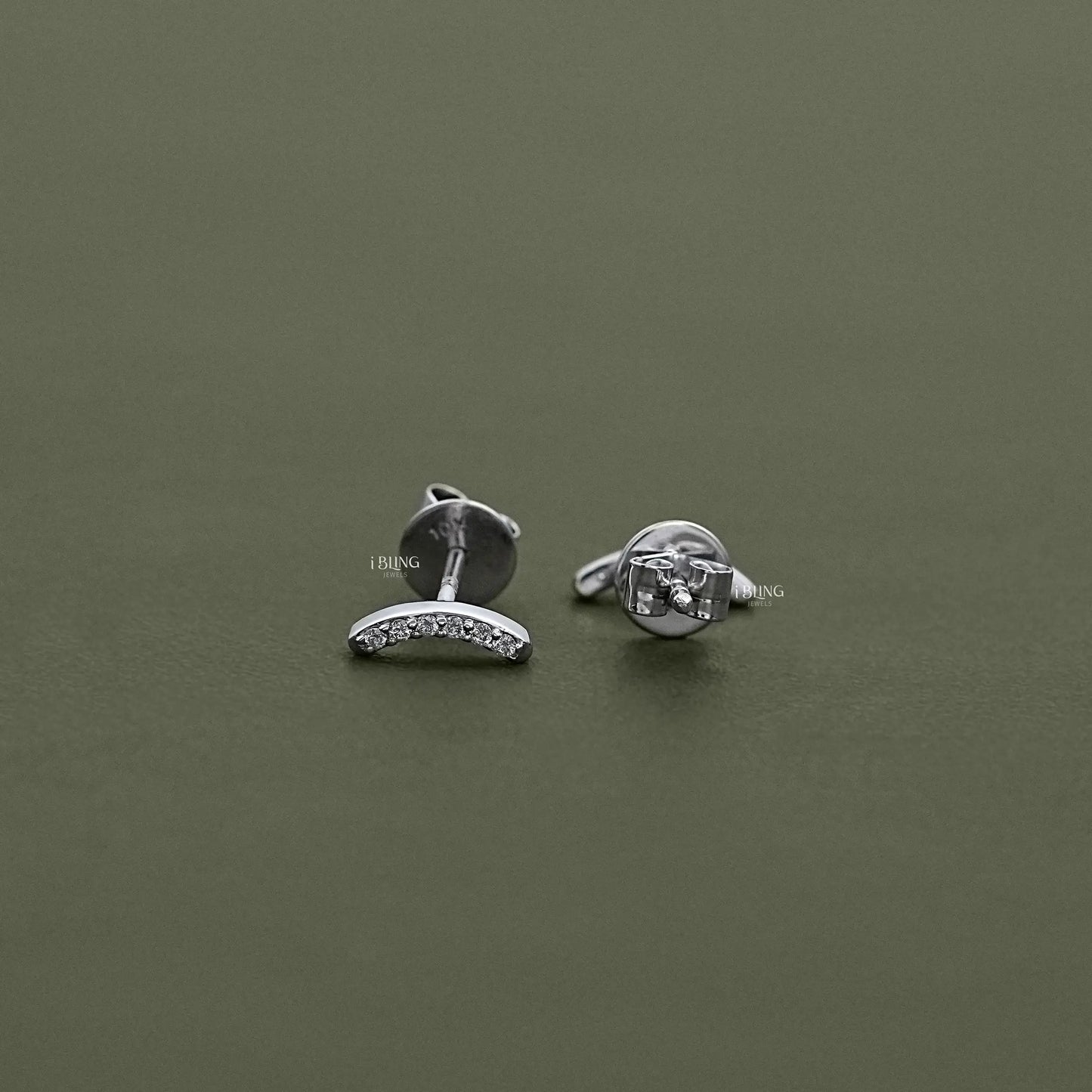 Curved Bar Round Diamond Stud Earrings in a flat-lay view, fine jewelry crafted for modern daily wear