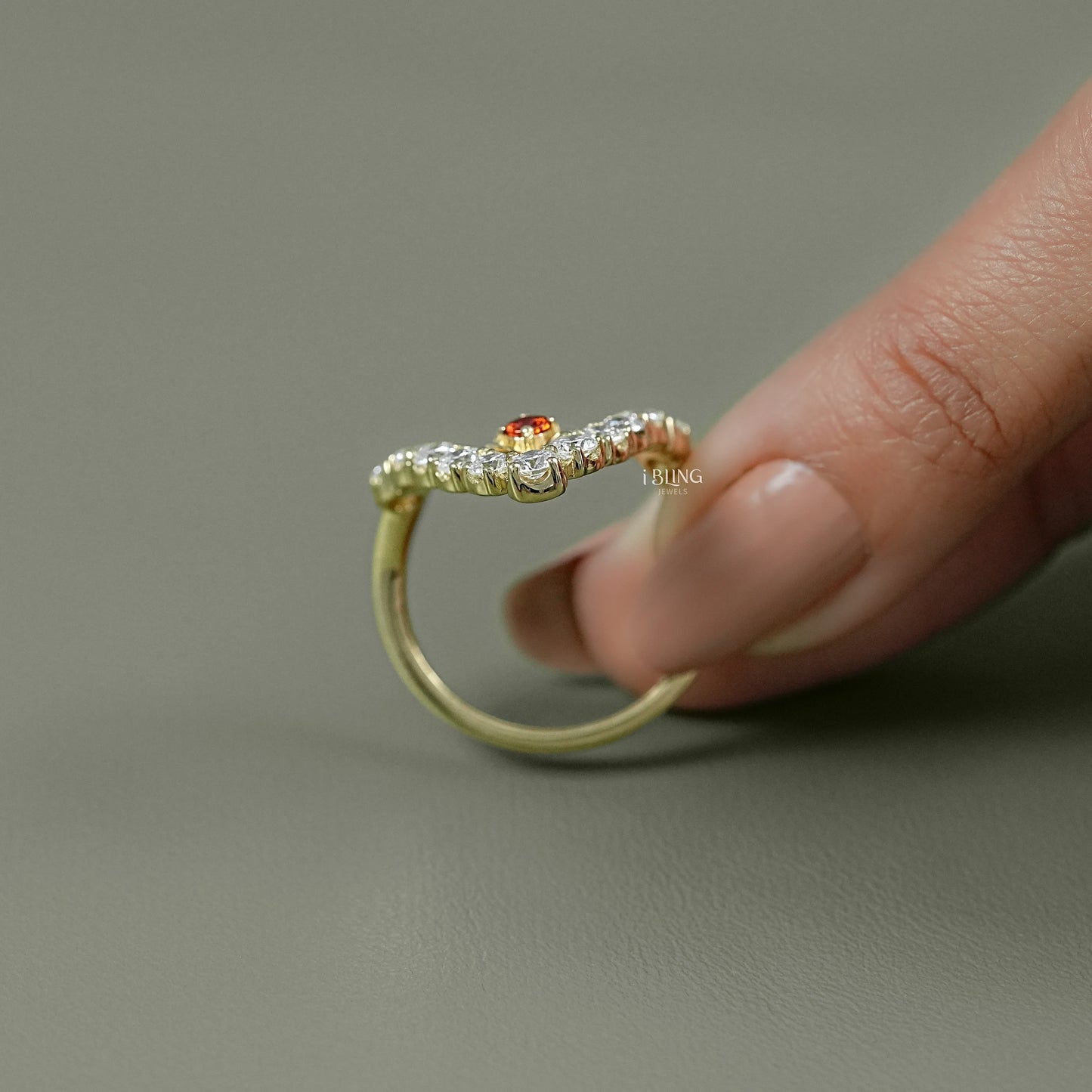 Side profile of vintage ruby engagement rings showcasing curve and prong-set stones.