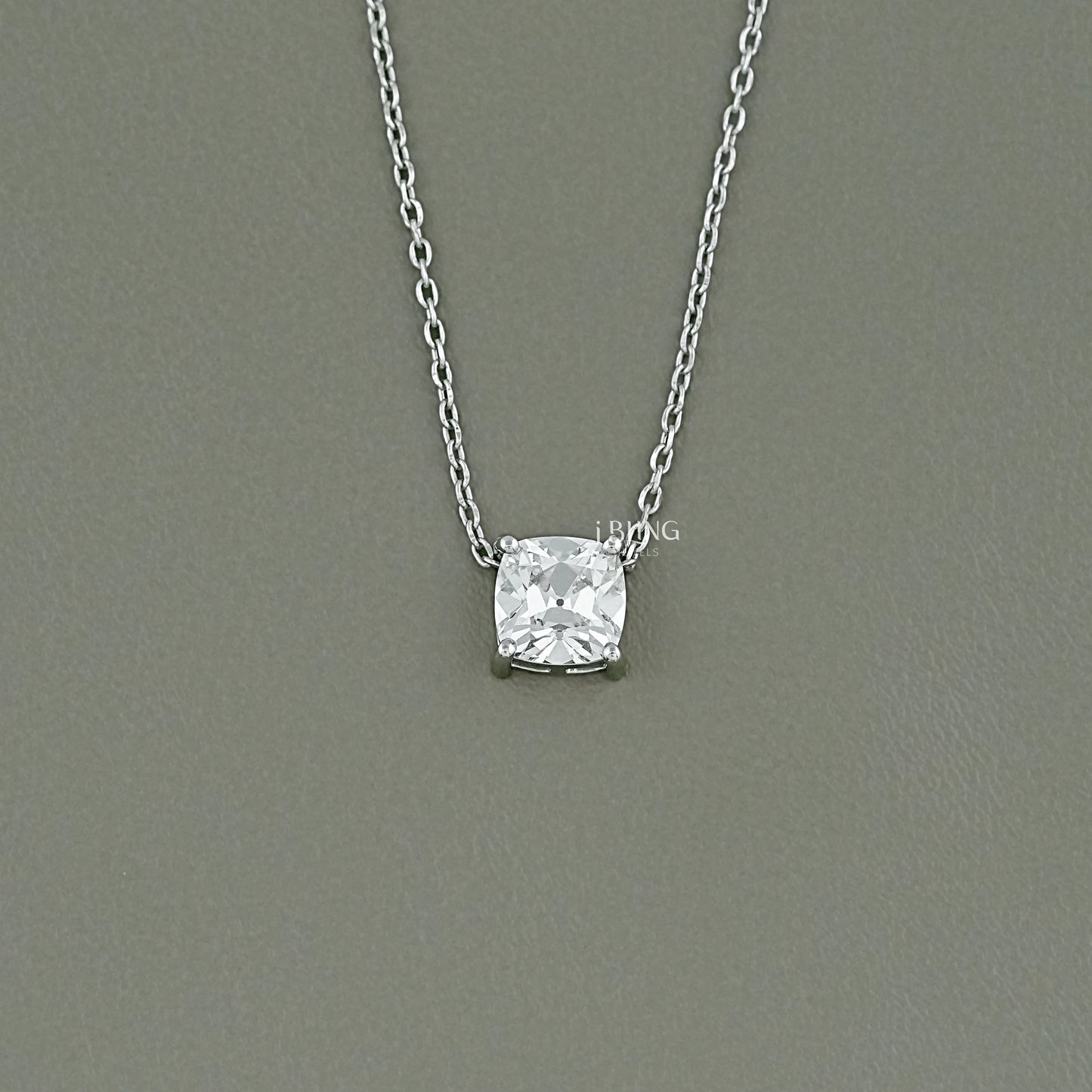 iBling Jewels old mine cut diamond solitaire necklace in a minimalist four-prong gold setting.