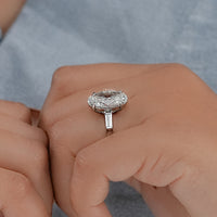 Oval And Tappered Baguette Cut Three Stone Ring
