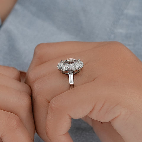 Oval And Tappered Baguette Cut Three Stone Ring