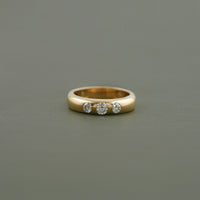 Three Stone Round Cut Flush Set Wedding Band