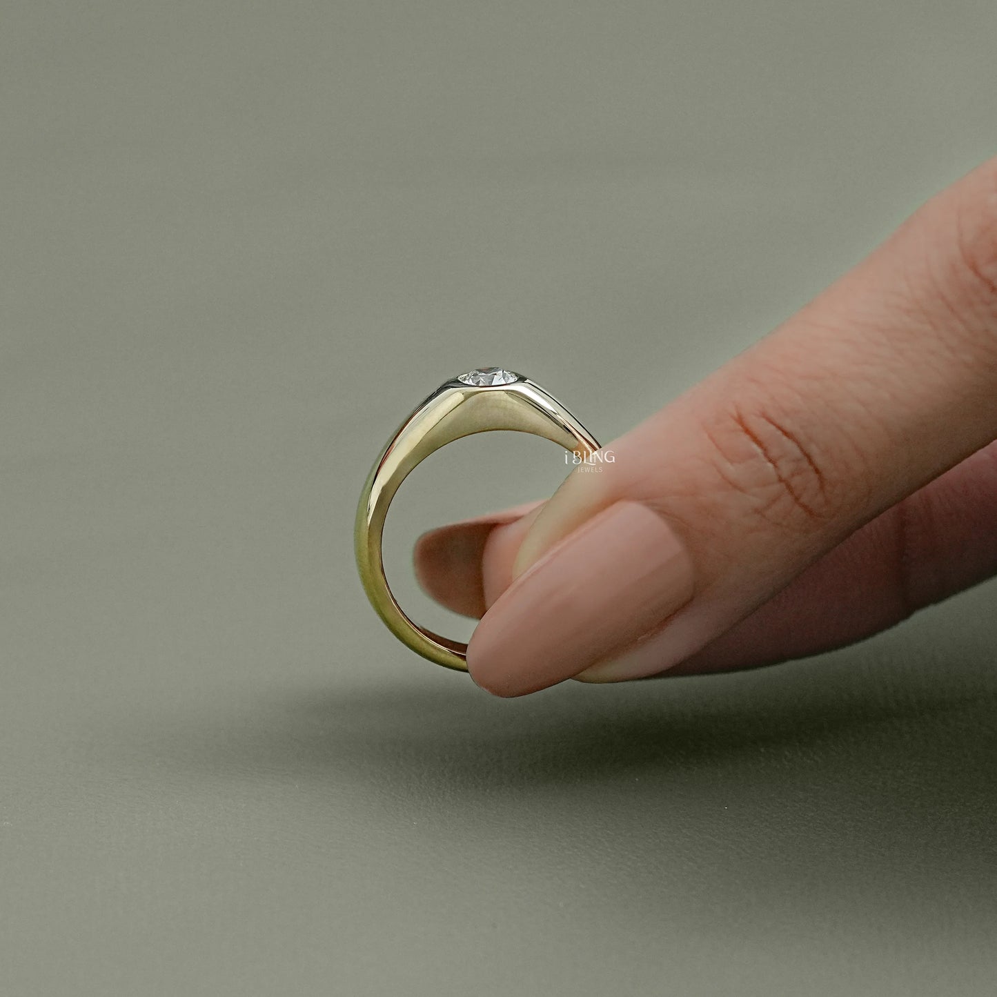 Top down view of a vintage cushion cut diamond ring with a precision-set centered stone.