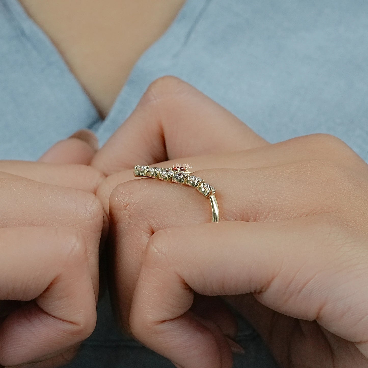 Vintage 14k gold ruby ring worn on the finger, perfect for stacking with bridal wedding sets.